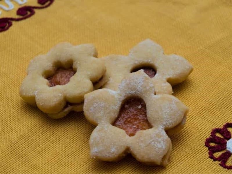 3 Vanocni Cukrovi, filled Czech christmas cookies. Assorted shapes cut in the top, circle, bell and star.