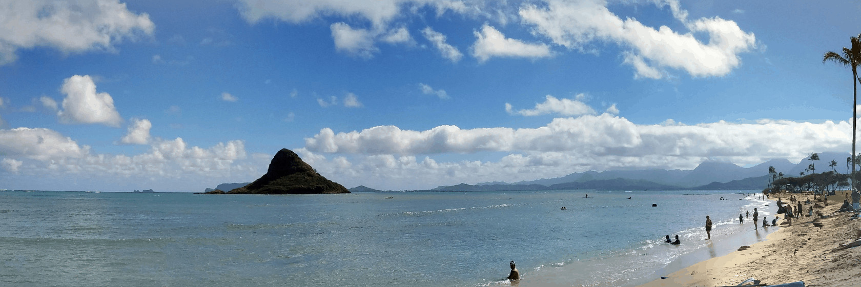 oahu beach and mountain with water in foreground