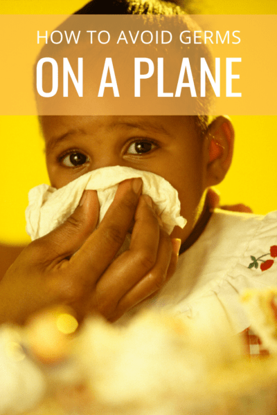 Mom wiping child's nose text says how to avoid germs on a plane