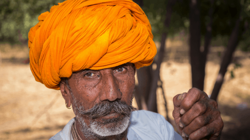 Keralite man dressed in bright orange turban. The entire Kerala by Nature ad campaign is based on its wonderful people.