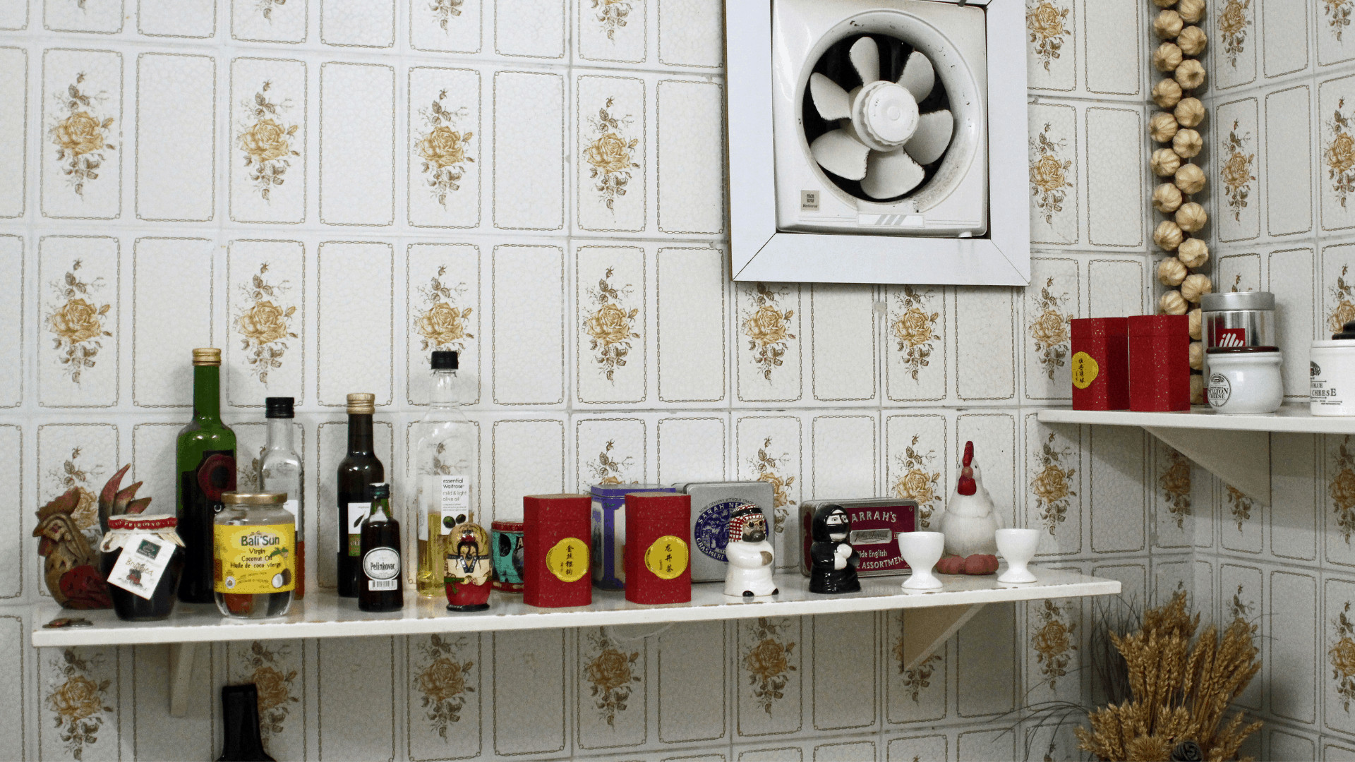 1970s kitchen shelf and fan ripe for a home update.