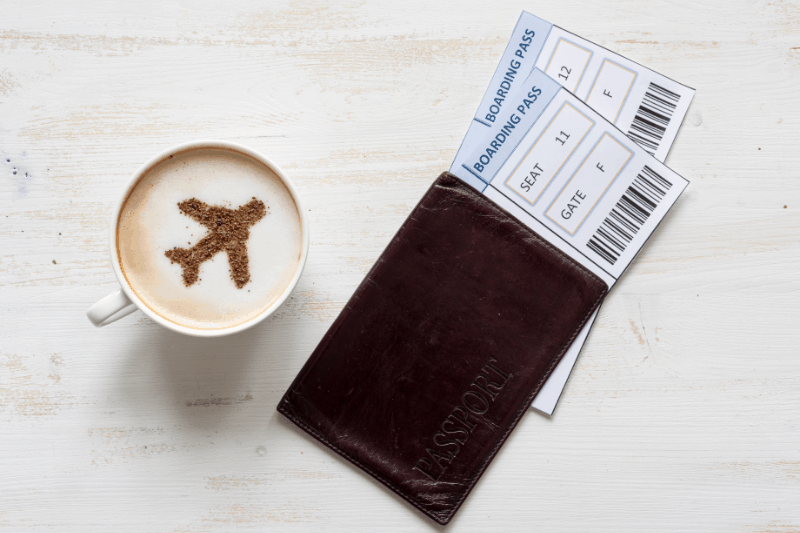 a cappuccino with a passport and boarding passes