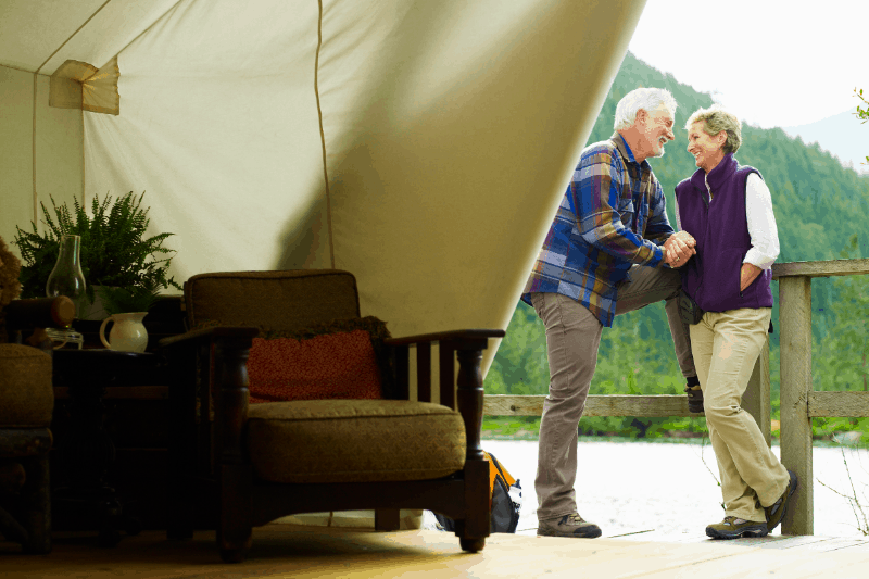 Luxury safari tent with couple outside