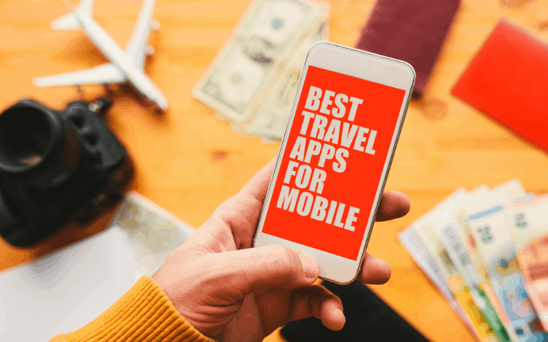 Hand holding a phone with words that say Best Travel Apps for Mobile