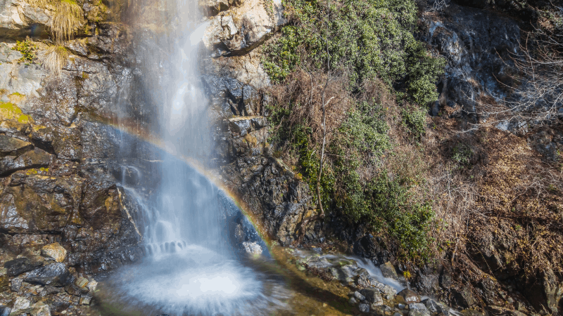 rainbow at the base of Caledonia Waterfalls