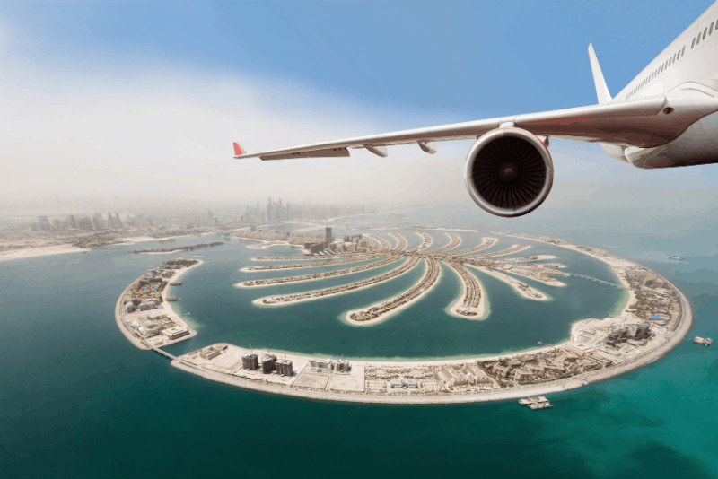 airplane wing above dubai - 1 week 7 day uae itinerary