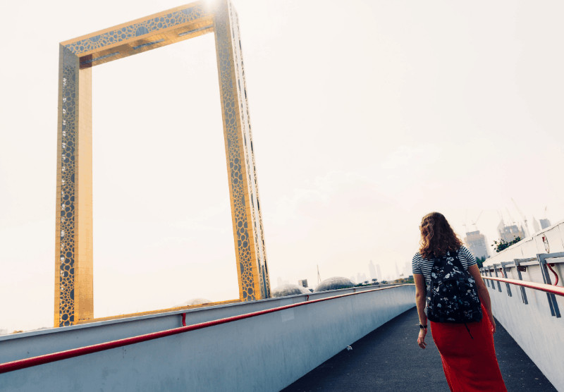 woman on walkway next to Dubai Frame, part of the 7 day UAE itinerary