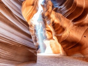 sunlight shining through a slot at Antelope canyon, one of the day trips from las vegas