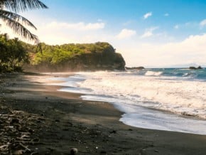 black sand beach on Domnica