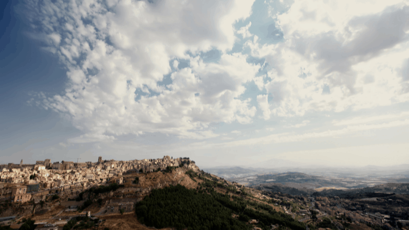 Enna Sicily on top of a hill, with Mt Etna on the horizon