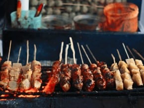 penang food guide featured image showing skewers of grilled satay 