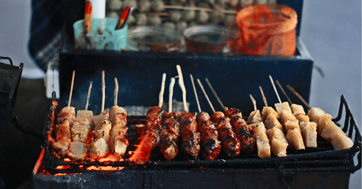 penang food guide featured image showing skewers of grilled satay 