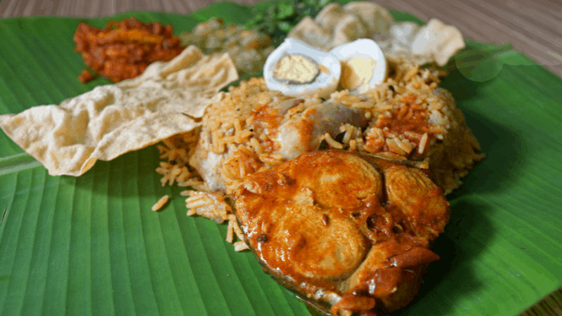 assorted foods on a banana leaf penang
