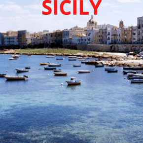 small boats anchored on the water in Ustica. Text overlay says "Unusual places to visit in Sicily"