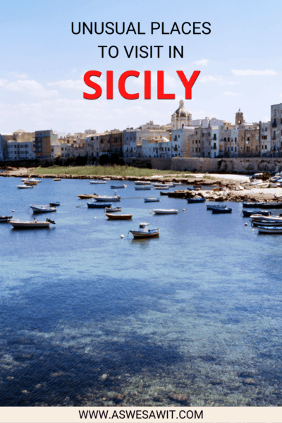 small boats anchored on the water in Ustica. Text overlay says "Unusual places to visit in Sicily"