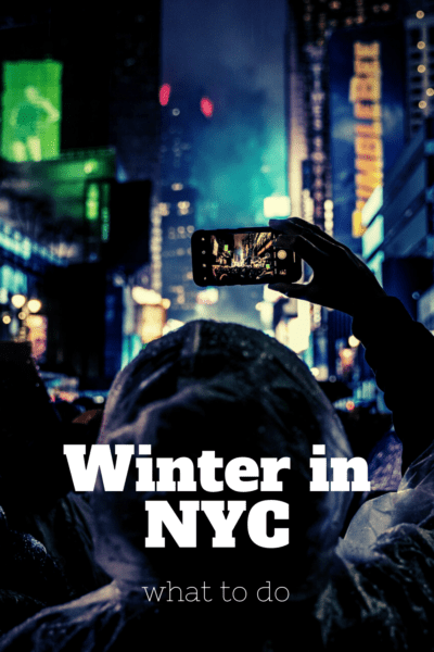 Person taking a photo of the Ball Drop at Times Square. text overlay says winter in nyc what to do