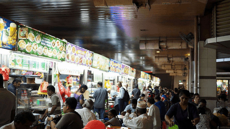 Tekka Centre hawker booths and customers at tables