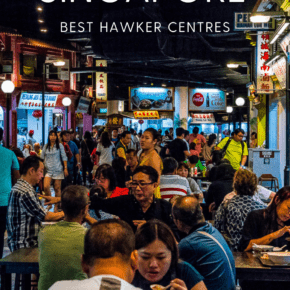 People eating food outside after dark, hawker stands on periphery.  Text overlay says "eat cheap in Singapore best hawker centres as we saw it dot com."