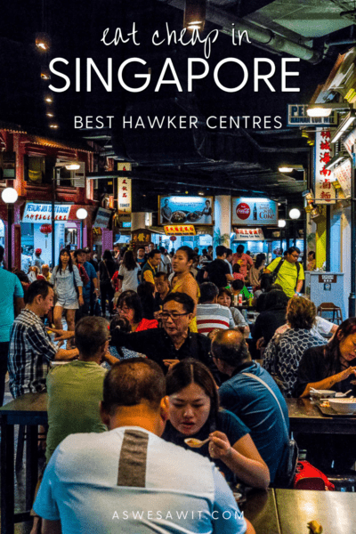 People eating food outside after dark, hawker stands on periphery.  Text overlay says "eat cheap in Singapore best hawker centres as we saw it dot com."