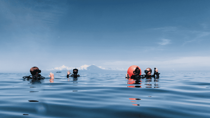 divers surfacing in Indonesia