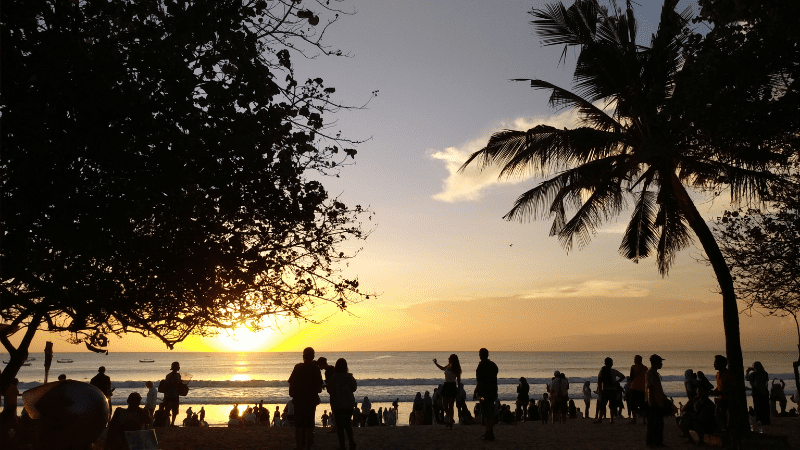 people partying on a beach in Indonesia
