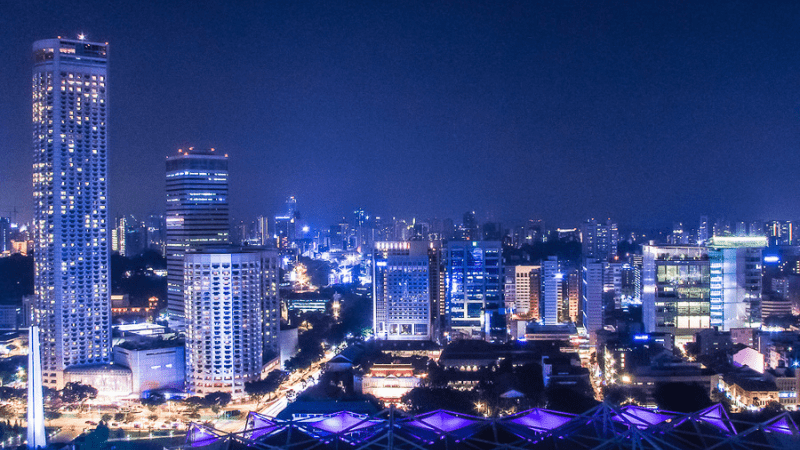 Singapore skyline at night. Even though it's not one of the things to know before visiting Singapore, rooftop bars give you amazing views of the skyline.