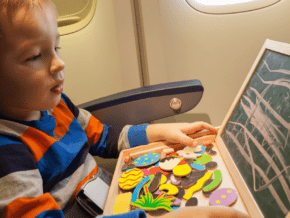 child having fun on an airplane