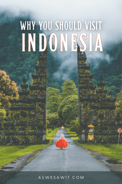 Person approaching Balinese gate. Text overlay says "why you should visit indonesia"