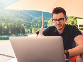 Man on the computer outdoors