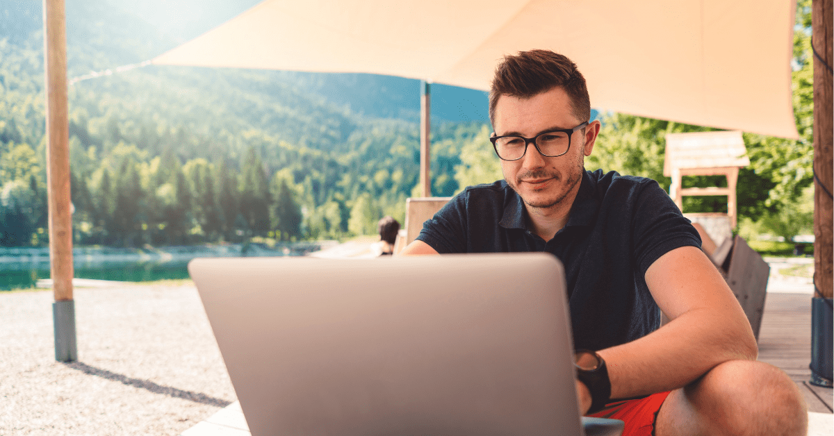 Man on the computer outdoors