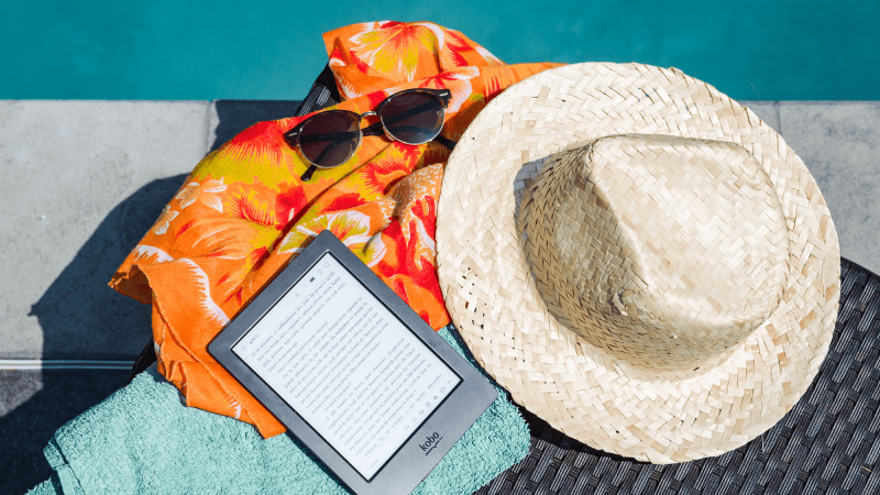 Kindle ebook reader, Sun hat, sunglasses and blanket