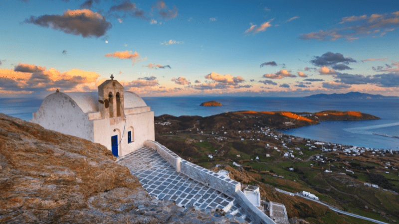 A church on a hill in Serifos, one of the best Greece Islands. Mediterranean in background