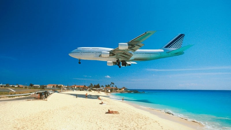 plane flying over Maho Beach