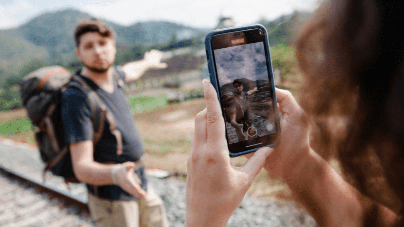 Man vlogger being videoed by woman