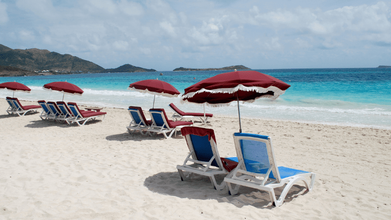 beach chairs and umbrellas on Orient Baie
