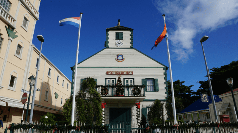 courthouse on Philipsburg Sint Maarten. Flags in foreground