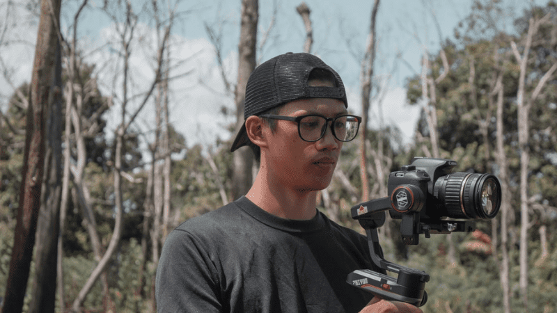 travel vlogger in forest creating video content for beginners