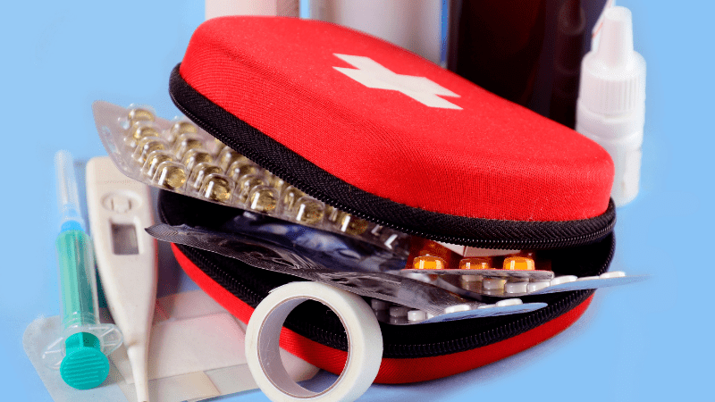 first aid kit with pills and other essentials