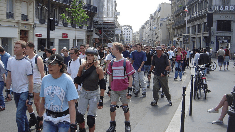 People roller skating thru Paris