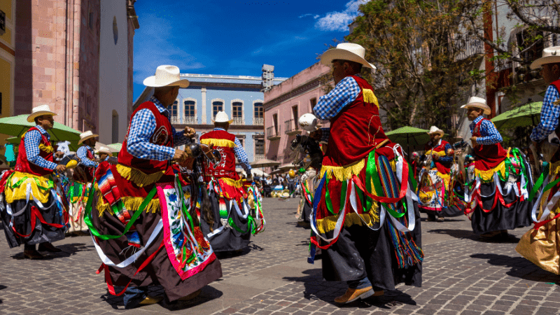 Men dressed in colorful cowboy costumes for the Jerez Horse Festival