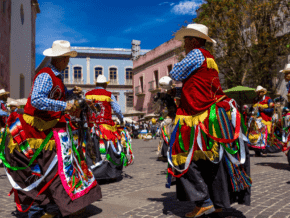 Men dressed in colorful cowboy costumes for the Jerez Horse Festival