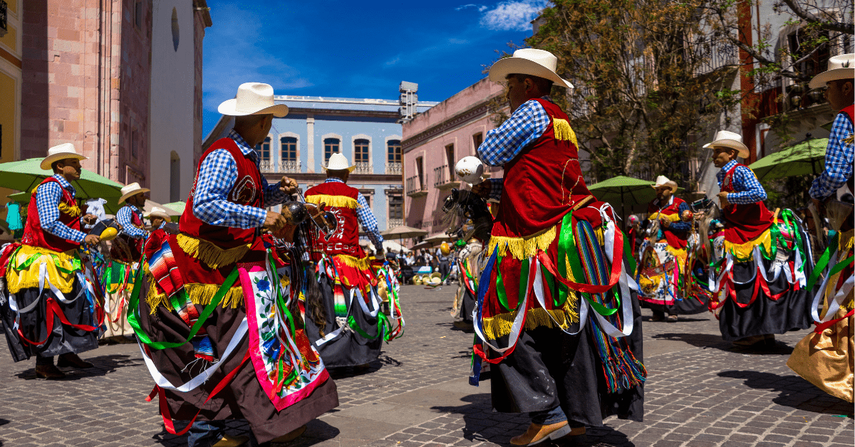 Men dressed in colorful cowboy costumes for the Jerez Horse Festival