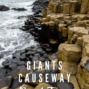 Giants Causeway stones and Northern Sea waves. Text overlay says "Giants Causeway road trip"