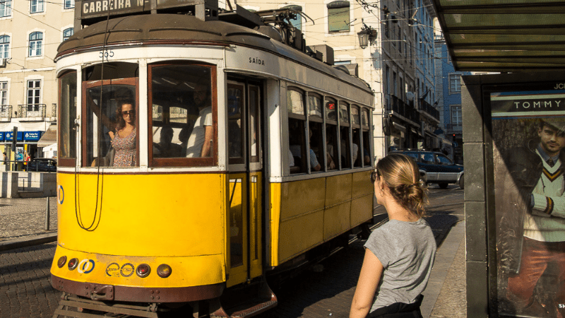 Woman waiting for a tram in Lisbon