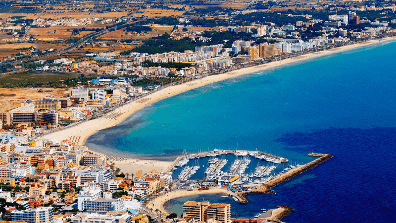 Aerial view of Palma de Mallorca waterfront, beach and city.