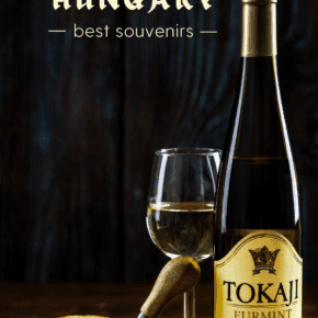 bottle and glass of Tokaj wine. Text overlay says "what you should buy in hungary Best souvenirs"