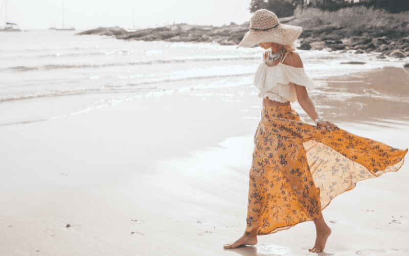 woman wearing loose fitting clothing on the beach