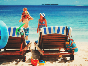 Family at the beach, with lots of beach gear