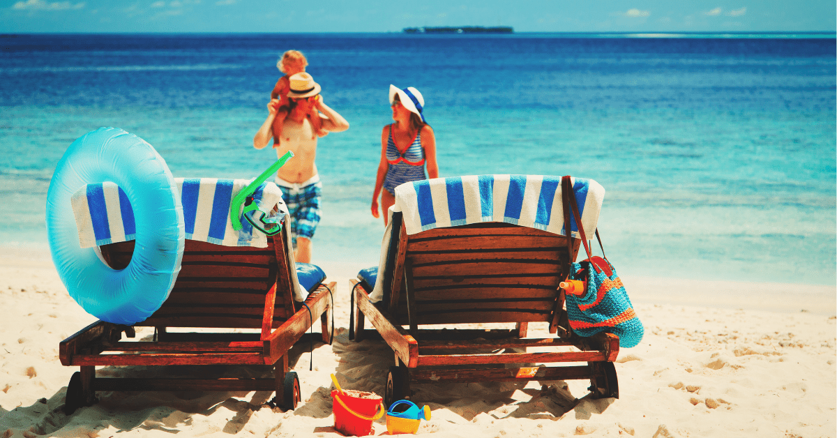 Family at the beach, with lots of beach gear