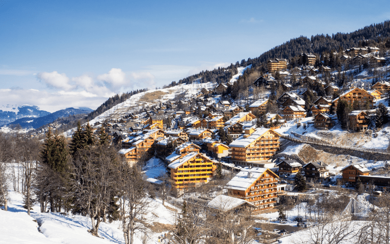 snow on the rooftops of a small town in the Dolomites in winter